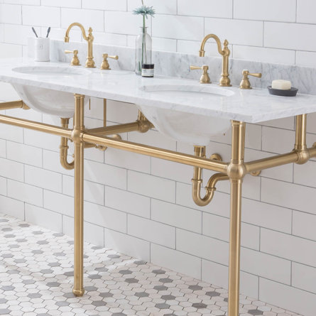 Double washstand with marble countertop and brass hardware.