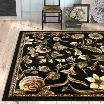 Tapis noir, bourgogne et ivoire à motif floral Gossard