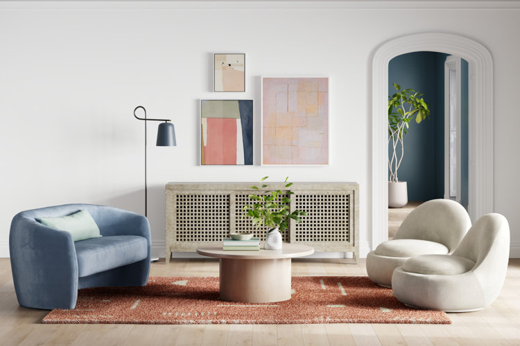 modern living room with three pieces of abstract artwork