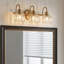 Luminaire pour meuble-lavabo en laiton antique à 3 lumières Kella, verre transparent Lotus, base E26, fixation murale pour salle de bain