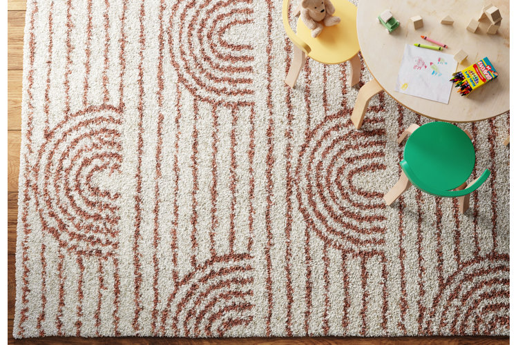 geometric area rug beneath a kids table