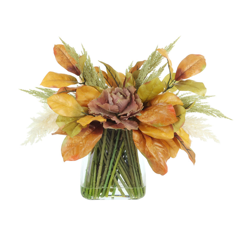 Centre de table d'automne avec choux, pampas et feuilles d'automne