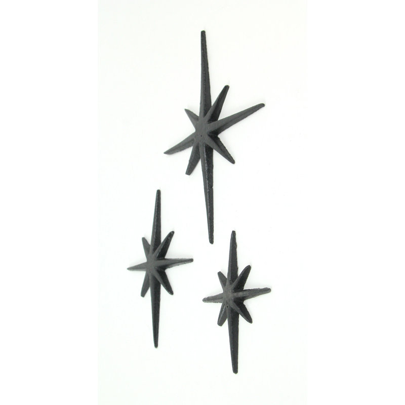Ensemble de 3 décorations murales en fonte émaillée noire, style moderne du milieu du siècle, représentant une étoile à 8 branches — Dimensions : 8,5 x 6,75 cm, 6,75 x 5,25 cm et 5 x 4,25 cm (H x L), 0,25 cm (P).