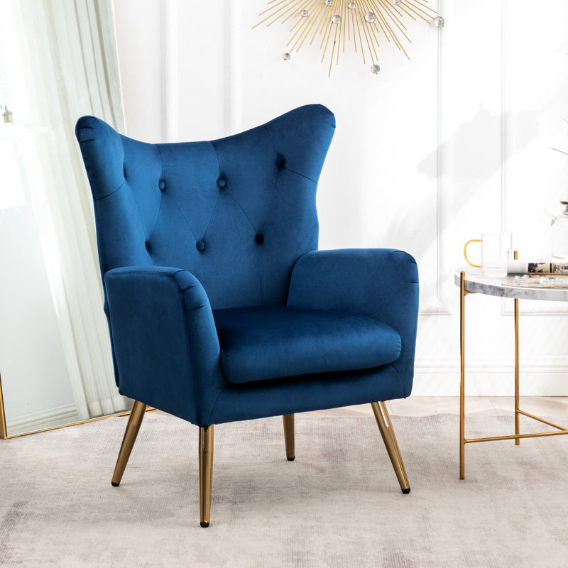 Fauteuil en velours bleu avec dossier à oreilles et dossier. Classique et élégant. Pieds. Protection de plancher. L 30,02 po x P 26,5 po x H 35,5 po. Instructions d'assemblage fournies avec pieds élégants en métal doré