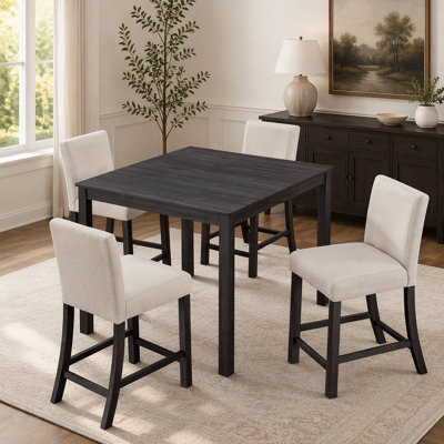 Ensemble table et chaises de salle à manger modernes cinq pièces, hauteur comptoir, pour les cuisines compactes.