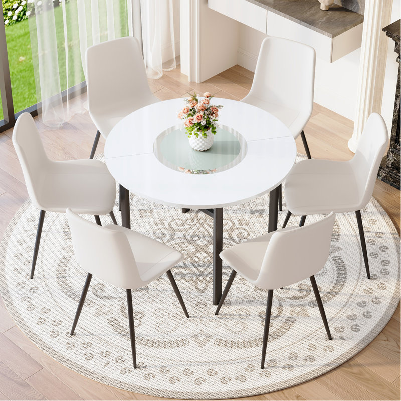 Ensemble de table et de chaises Ensemble de table de salle à manger moderne et minimaliste blanc de 42 pouces avec 4 chaises en polyuréthane artificiel blanc avec coussins incurvés. Convient à la salle à manger, au bureau, etc.