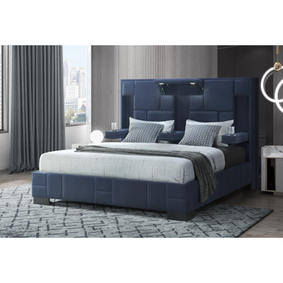 Très grand lit contemporain bleu marine avec haut-parleurs intégrés, recharge sans fil et lumières bleues, lecture pliable