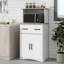 Armoire de rangement polyvalente à plusieurs niveaux avec tablettes réglables, tiroir central et section centrale ouverte pour organiser les cuisines modernes