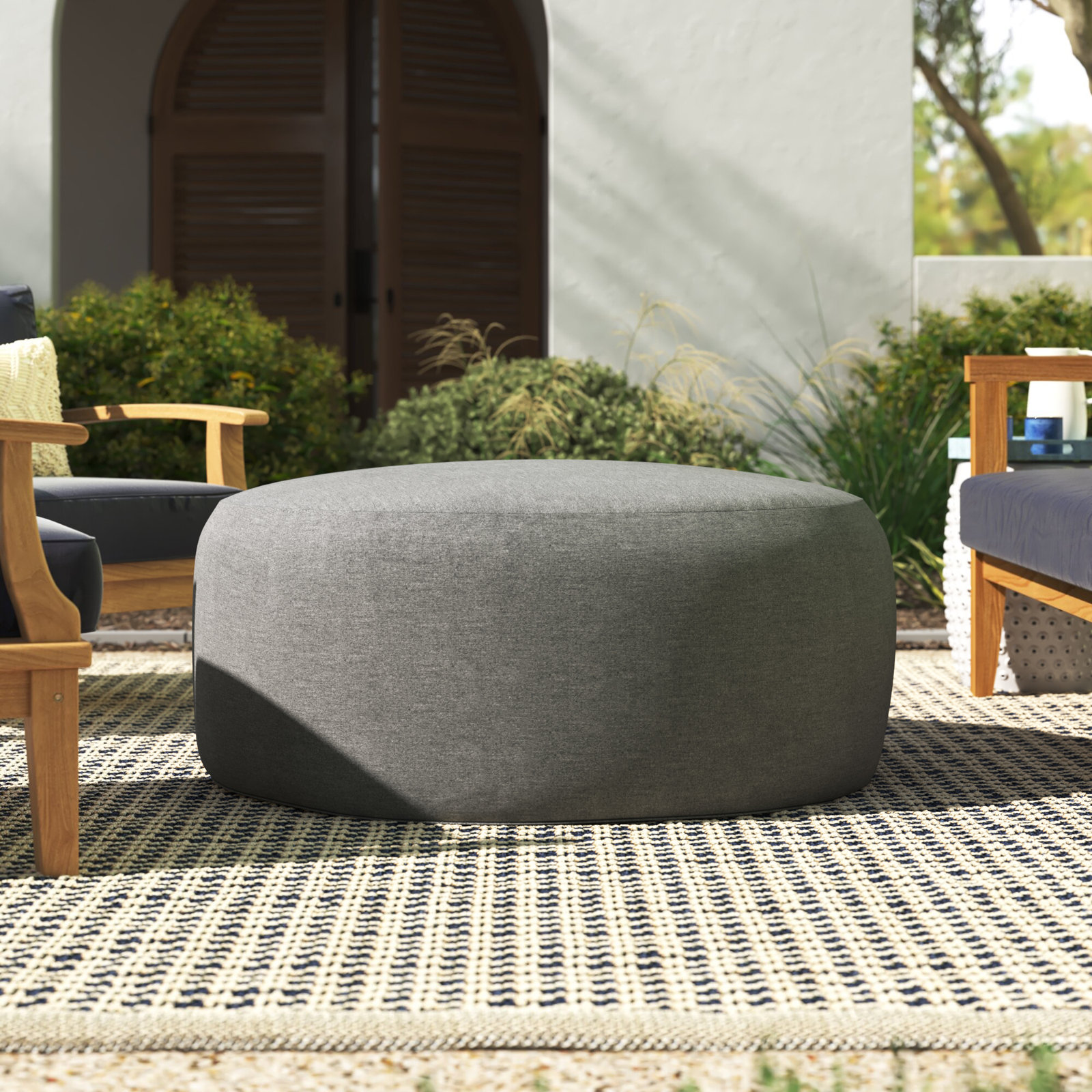 Hania Round Upholstered Outdoor Ottoman with Sunbrella® Cushion