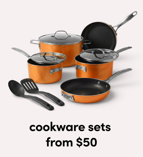 Set of orange and black cookware pots and pans.