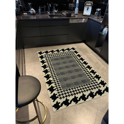 Tapis tissé à motif écossais et pied-de-poule