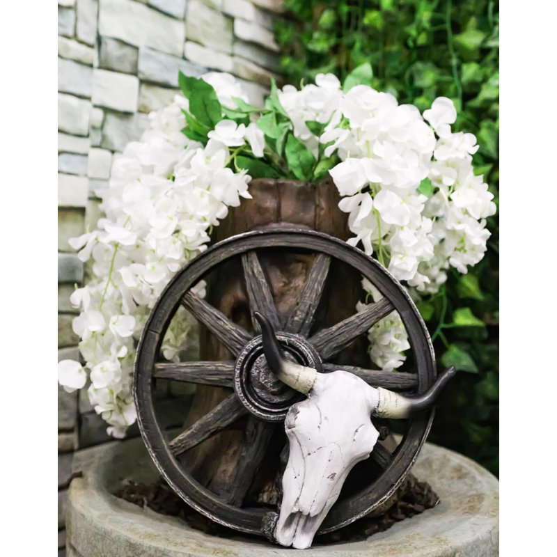 Roue de chariot rustique en forme de crâne de vache par tronc d'arbre ou vase décoratif