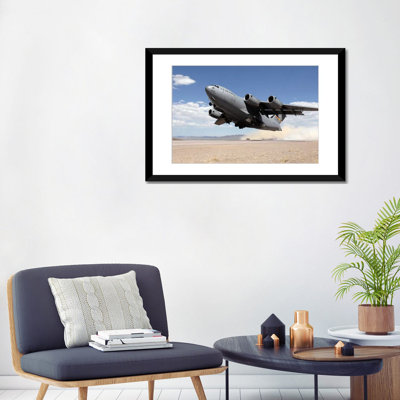 " A C-17 Globemaster Departs From The Tonopah Runway " by Stocktrek Images