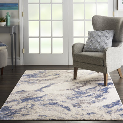Tapis bleu / beige tissé à la machine