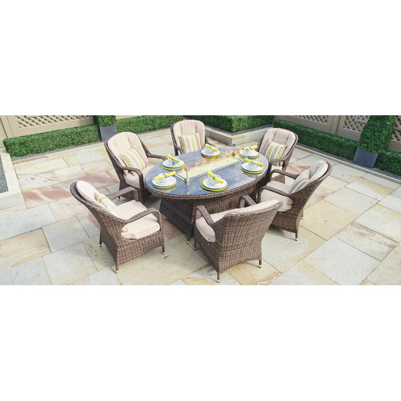 Emilie 6 - Person Wicker Patio Dining Set with Oval Table , Cushions Included