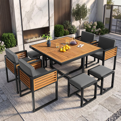 Ensemble de salle à manger 9 pièces en bois d'acacia de qualité supérieure avec coussins, 4 chaises rembourrées, 4 repose-pieds et 1 table carrée