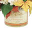 Composition d'hortensias et de feuilles d'automne dans un vase étiqueté