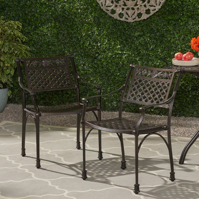 Charming Cast Aluminum Dining Chair With Graceful Lattice Pattern And Floral Carvings For Outdoor Spaces