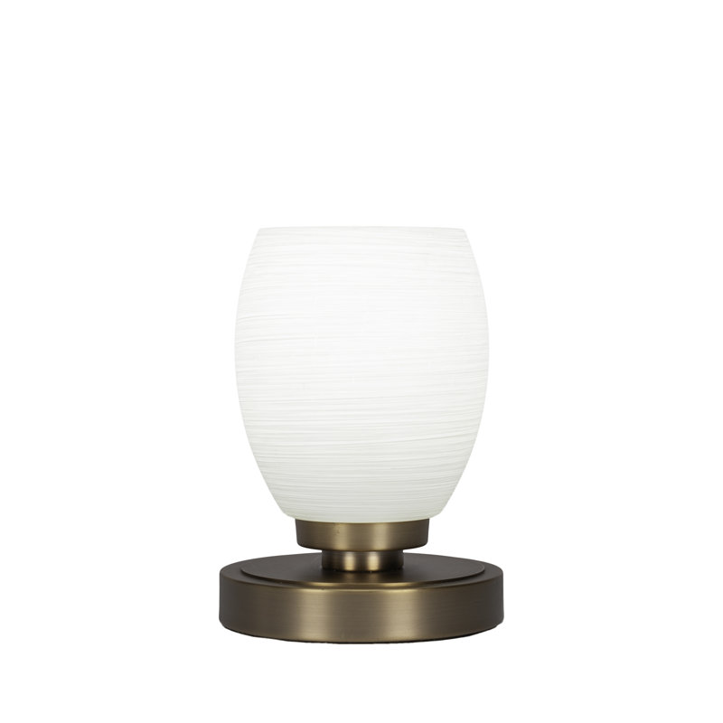 Lampe d'appoint Aneka montrée dans une finition laiton nouvel âge avec verre de lin blanc de 5 po
