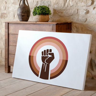 Reproduction d'art sur toile, "Un emblème circulaire avec poing levé stylisé"