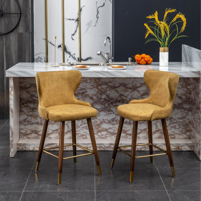 2 tabourets de comptoir modernes de style Mid-Century 2 places - siège en similicuir, garniture cloutée, pieds incurvés en noyer de style Mid-Century (paire), repose-pieds en métal,