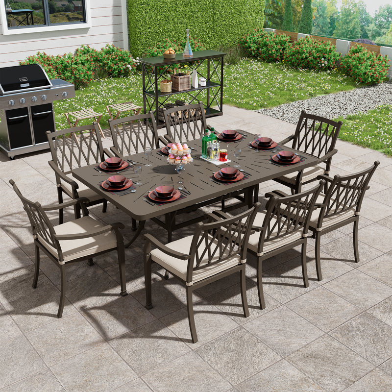 Wike 8 - Person Patio Dining Set Umbrella Hole Included Rectangular Table with Cushions Included, Beige