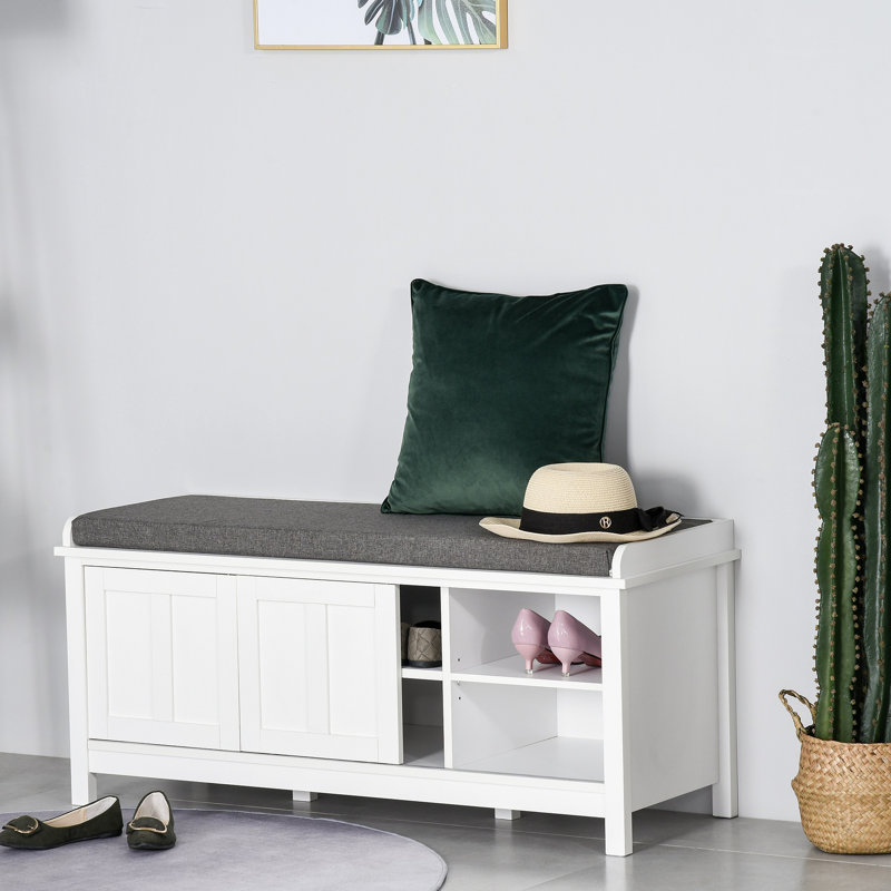Le repose-pieds de rangement pour hall d'entrée avec portes coulissantes, tablettes réglables, 6 compartiments et siège rembourré peut contenir 10 paires