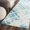 Bryauna Hand Tufted Wool/Cotton Geometric Rug in Blue/Ivory