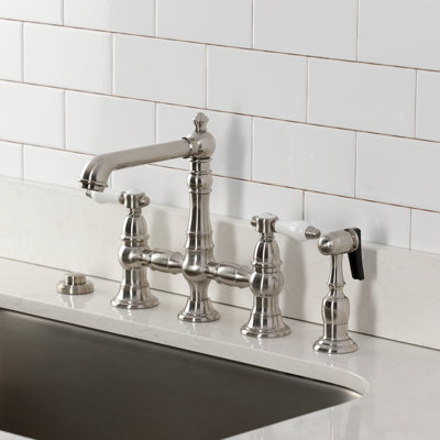 Kingston Brass Bel-Air Two-Handle 4-Hole Deck Mount Bridge Kitchen Faucet With Brass Side Sprayer