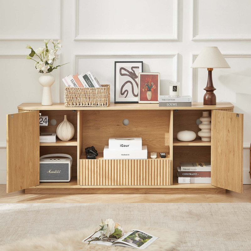 Meuble télé ondulé avec portes à ressorts et beaucoup de rangement