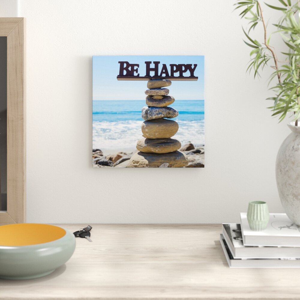 Leinwandbild Steinturm bei Happy am Strand