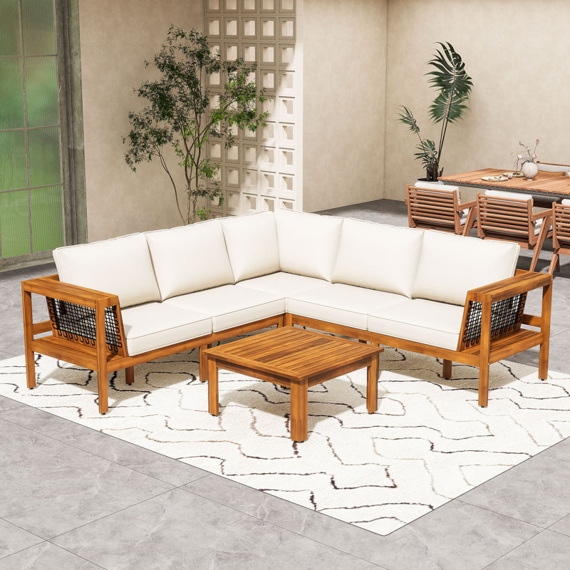 Ensemble de conversation modulaire en L 4 pièces en bois d'acacia avec table basse et coussins pour patio, terrasse ou bord de piscine