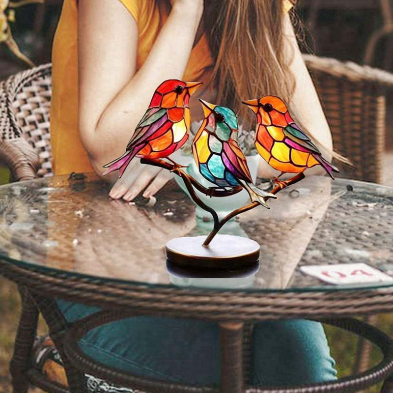 Figurine d'oiseau en acrylique sur une branche
