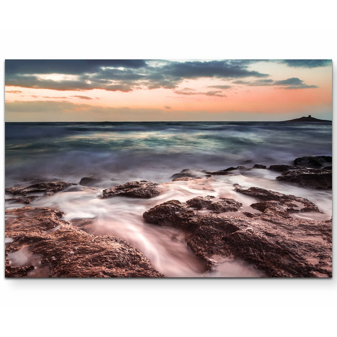 Leinwandbild Steinküste beim Sonnenuntergang