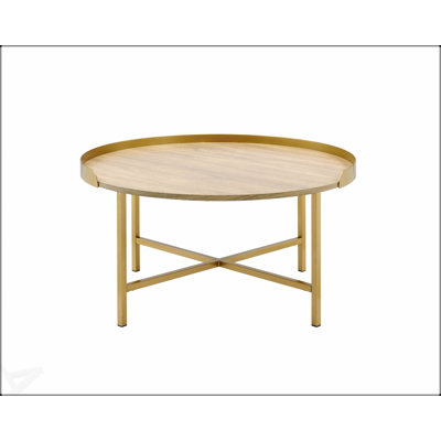 Table basse Mithea contemporaine en chêne et finition dorée, durable et élégante pour les petits espaces et les décors modernes.