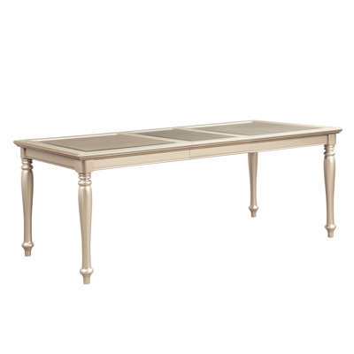 Table de salle à manger en bois à finition argentée avec insert en verre et rallonge pliable pour une pièce élégante