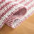 Isatou Hand Woven Wool/Cotton Striped Rug in Red/Ivory-1807550979