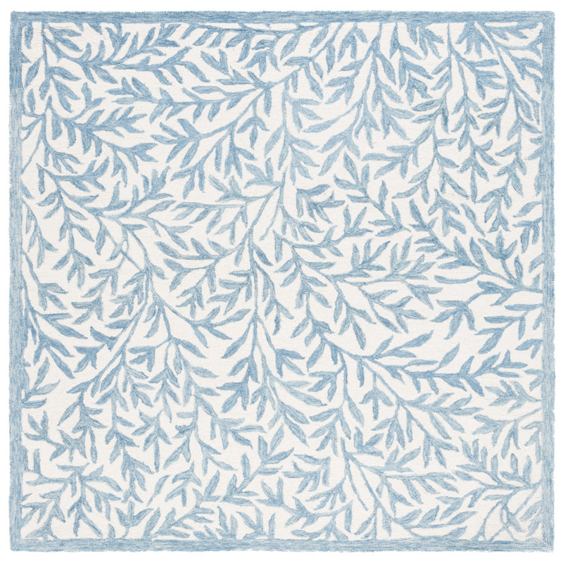 Iqarar Hand Tufted Wool/Cotton Floral Rug in Blue/Ivory, Rectangle 9' x 12'