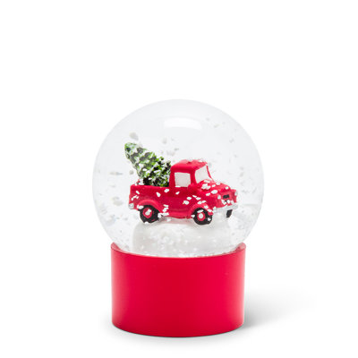 Camion avec boule à neige avec arbre