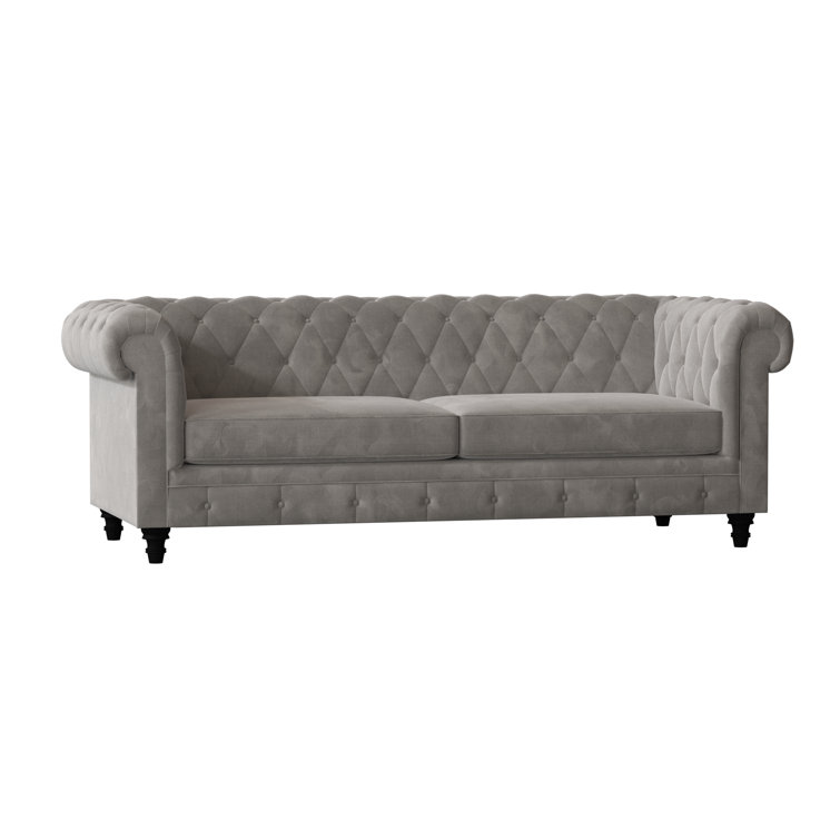 Canapé Chesterfield à accoudoirs roulés