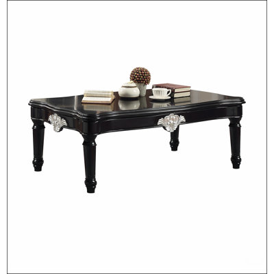 Table basse noire avec pieds tournés