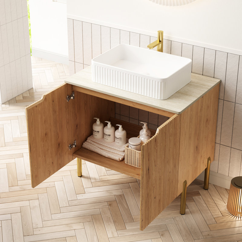 Meuble-lavabo autoportant de 76 cm avec lavabo en céramique blanche, comptoir en pierre frittée, rangement en contreplaqué, 2 portes à fermeture amortie, coloris assorti à la décoration. Style moderne, meuble de rangement et organisation.