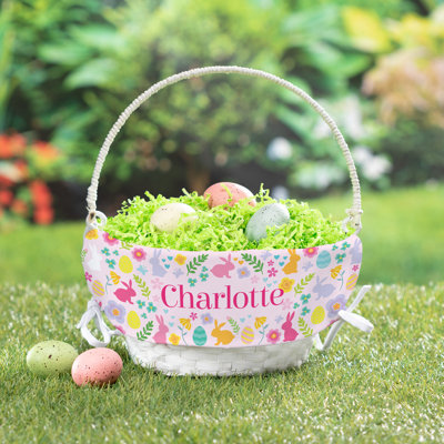 Panier de Pâques doublé de fleurs de lapin avec nom personnalisé imprimé en lettres rose vif sur panier tissé blanc avec poignée pliable