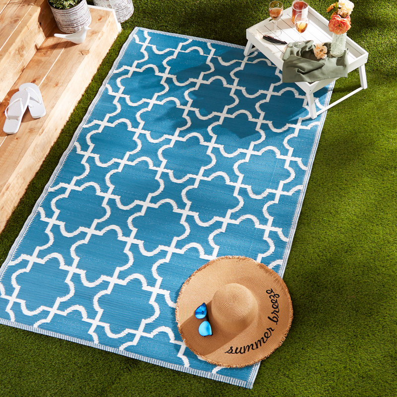 Tapis d'extérieur à treillis bleu et blanc Drusilla