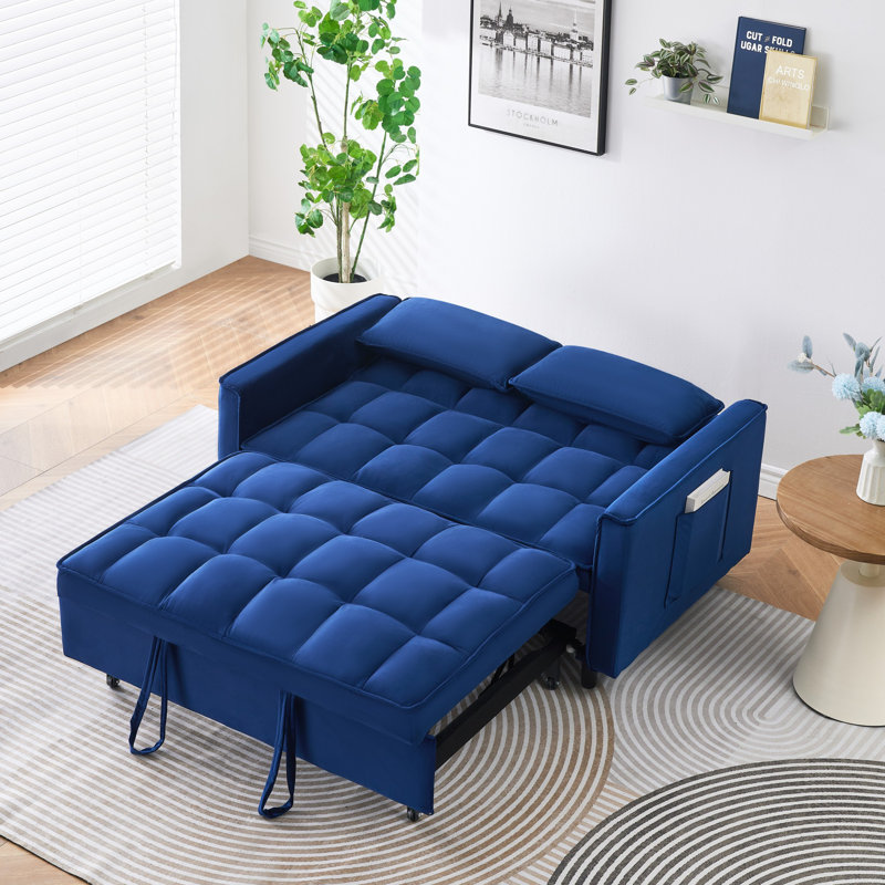 '' dreamlike blue velvet sofa with elegant design, convenient pockets, and three-in-one convertible functionality.