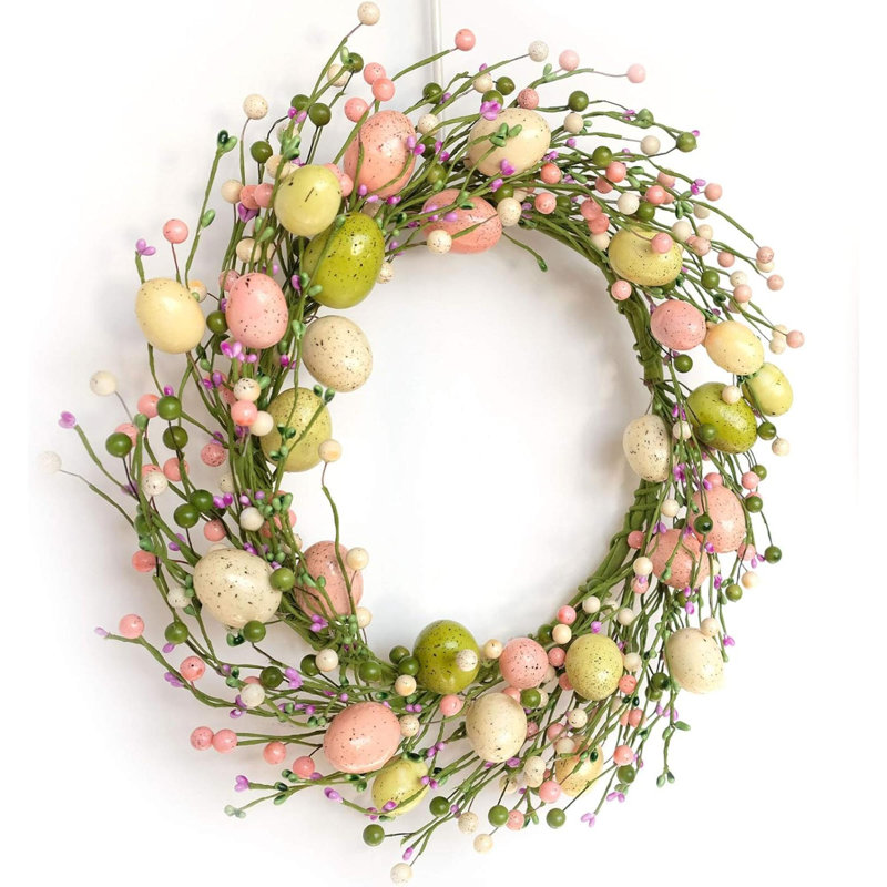 Couronne de Pâques avec œufs colorés pour décoration murale de porte d'entrée