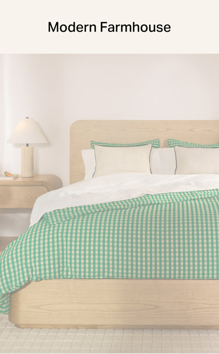 Modern Farmhouse bedroom featuring a light wood bed frame with a green and white gingham duvet cover and a matching table lamp on a nightstand.