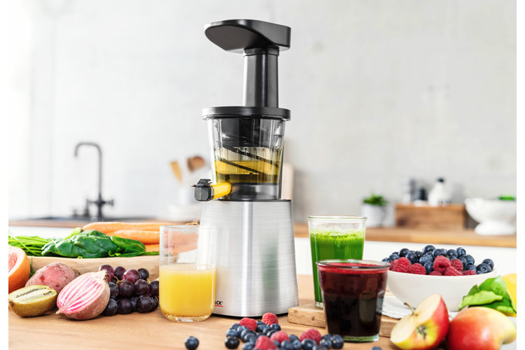 cold juice presser surrounded by an array of fruits and juices