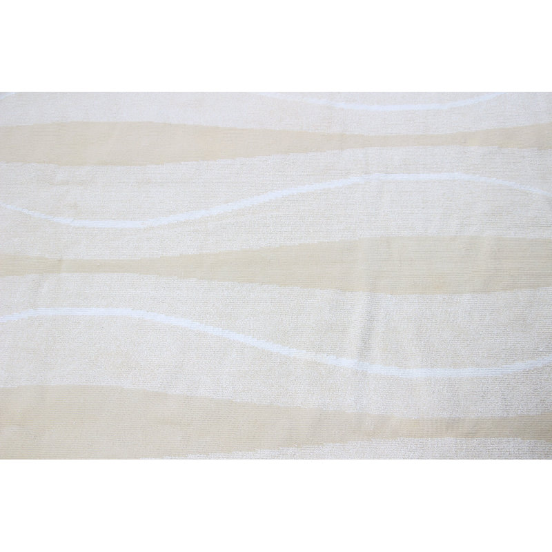 Tapis turc beige à motif de vagues et de tons neutres pour un décor minimaliste moderne et élégant