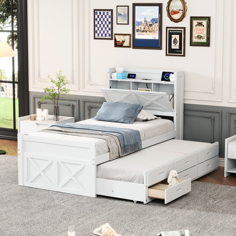 Lit simple avec prises de tête de lit et espace de rangement pratique